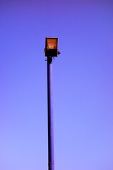 LED street lamp on a white day under a blue sky