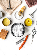 Tools for cutting beard in barbershop on workplace background top view