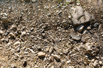 Background image of a stone crumb with small and large stones