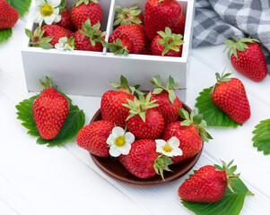Strawberries on white wood