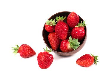 Strawberries in wooden bowl on white background