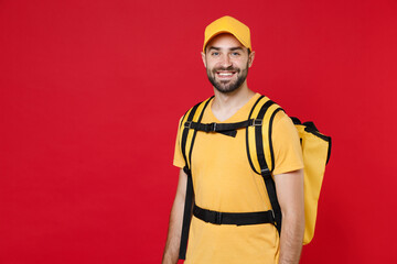 Delivery employee man guy male 20s in yellow cap t-shirt uniform thermal bag backpack with food...