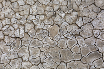 Drought, dried cracked earth. Cracks in clay. Water shortage problem