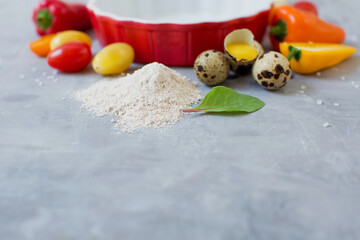 Baking dish with ingredients vegetable pie