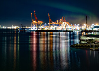 Fototapeta na wymiar harbor at night with aurora