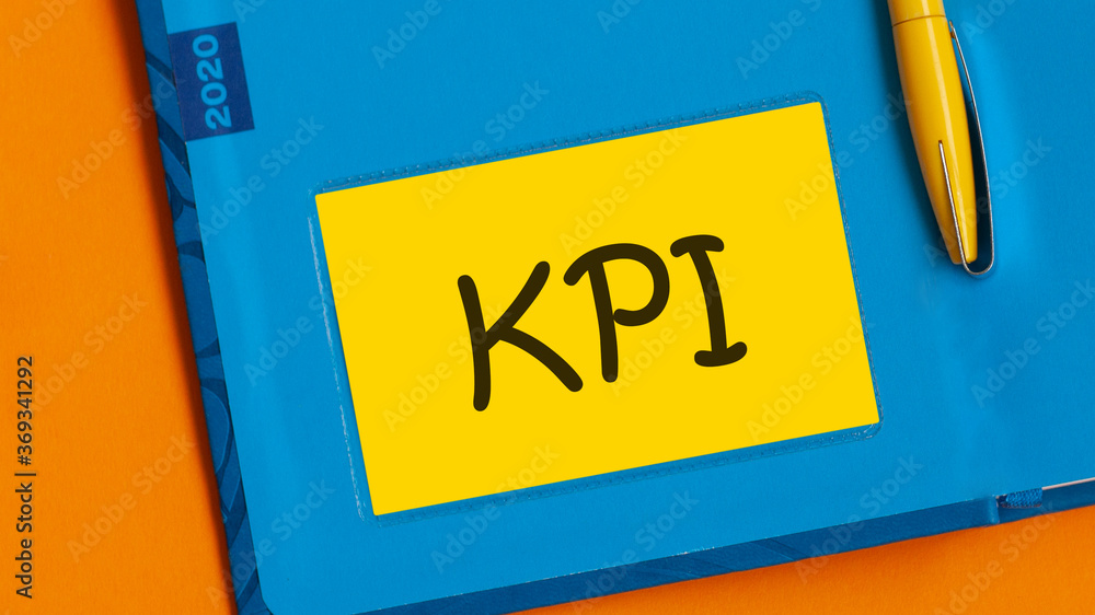 Poster the word kpi is written in black marker on the yellow paper for notes. kpi - key performance indicat