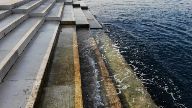 Zadar, Croatia, Sea Organ (morske orgulje) closeup of sea wave hitting the stairs