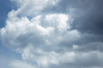 White clouds in blue sky background.