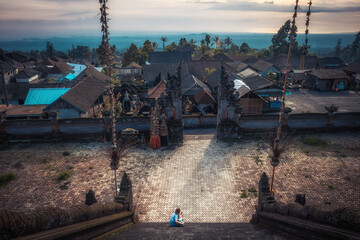 Bali Pura Besakih temple panorama high viewpoint from temple stairs scenery on horizon during sunset as Bali travelling lifestyle