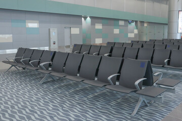 Empty chairs in terminal of airport. 