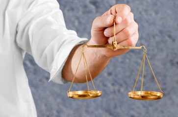 Weight scales in hand on blur background