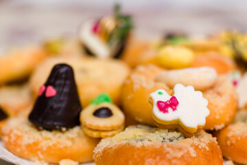 Wedding cookies on wedding cakes.
