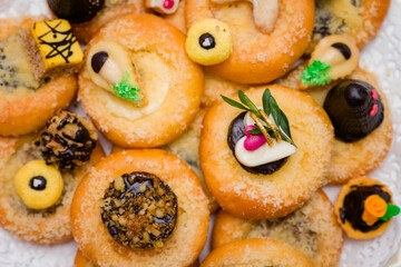 Wedding cookies on wedding cakes.