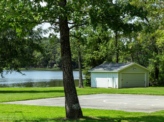 a garage building next to a lake in Conroe, TX.