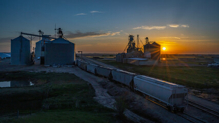 Grain Elevators and Railroads in the Setting Sun of the Great Plains