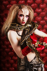 burlesque woman holding phyton