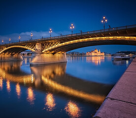 Fototapeta na wymiar Margaret Bridge with the Parliament in Budapest