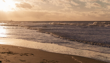 golden sunset on the north sea in The Hague in the Netherlands