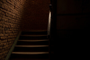 horror style dark hall and stairs path way corridor indoor space and brick wall background in photography with lights and shadows