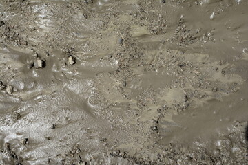 Mud texture or wet gray soil as natural background.