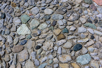 The road paved with river stones of various shades