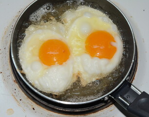Fried egg on a pan.