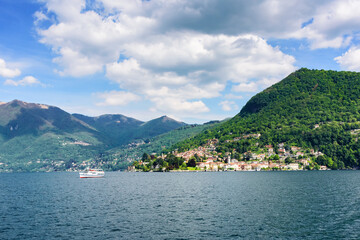 Fototapeta na wymiar Lake Como view of the surrounding mountains and coastal cities. Italy