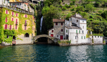 Fototapeta na wymiar Lake Como view of the bridge Ponte della Civera and Nesso gorge and the waterfall. Nesso Italy
