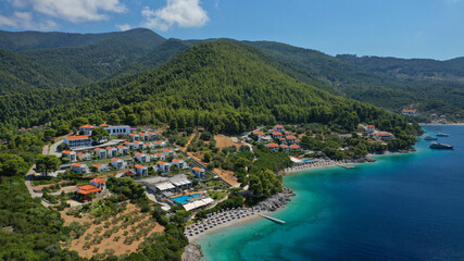 Aerial drone photo of beautiful tranquil turquoise beach of Antrines near famous Panormos beach,...