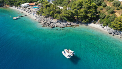 Fototapeta na wymiar Aerial drone photo of beautiful tranquil turquoise beach of Antrines near famous Panormos beach, Skopelos island, Sporades, Greece