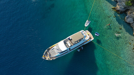Aerial drone photo of large yacht - boat anchored in tropical exotic paradise bay with emerald open...