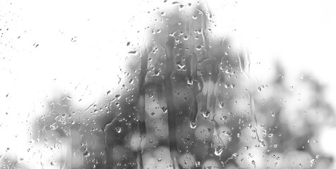 View through the window to garden of house, raining. Rainfall outside the window or outside the glass, Rain drops on window or on glass.