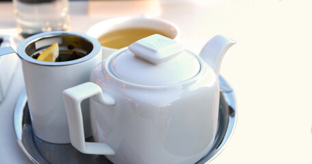 A cup of tea with a teapot. Vintage look.