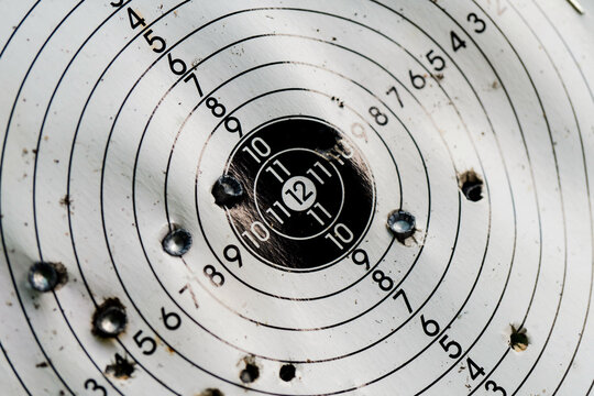 Used shooting target with traces of hit bullets