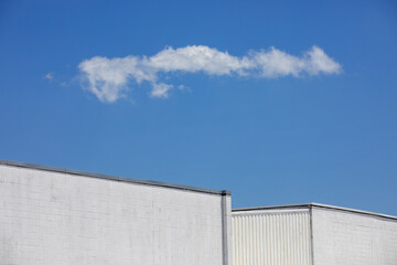 White building and cloud, USA.