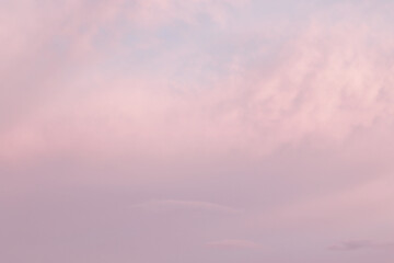 soft pastel pink evening sky with couds
