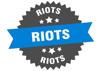 riots round isolated ribbon label. riots sign