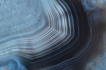 Full-screen texture of blue and white striped agate with quartz
