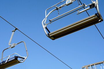 Old Mountain, Serbia, July ‎28, ‎2020, Empty ski lift chairs sitting idle during the summer....