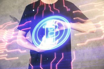 Double exposure of man's hands holding and using a phone and crypto currency blockchain theme...