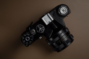 black vintage camera on solid background, top view, isolated
