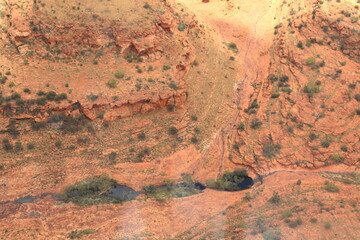 An incredible aerial view over the dry desert landscape of George Gills Range and Kings Canyon, Northern Territory, Australia