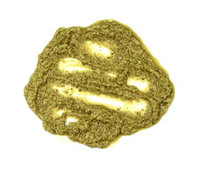 Pesto spread or blob in a bowl isolated on white background. Green italian homemade spilled sauce made of ground basil, garlic, pine seeds, olives and pecorino sardo cheese 