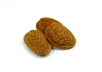 Unshelled almonds isolated on white background. Almond nut in shell.