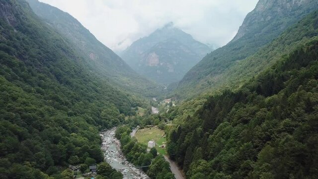 Lush Exotic Green Mountain Valley Road in Valle Verzasca, Switzerland - Aerial Drone
