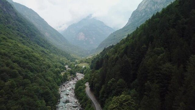 Epic Destination Road in Narrow Mountain Valley in Switzerland - Aerial Drone