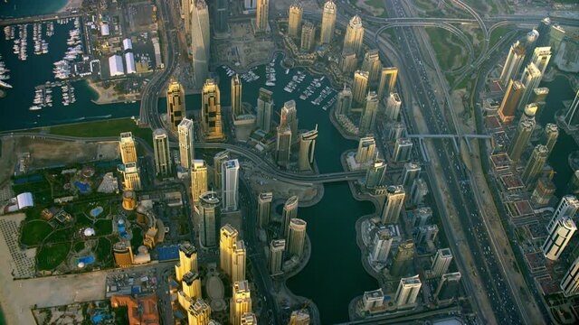 An Amazing Birdseye View Of Dubai Marina Slowly Tilts Up Capturing An Excellent View Of The Skyline And Busy Street Life On The Sides Of The Water Canal, 6-axis Stabilized Gimbal, Shotover F1, 8K.