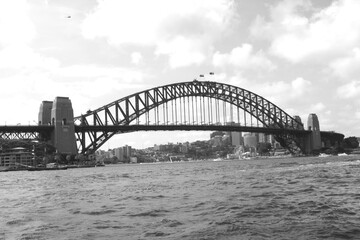 Fototapeta na wymiar Sydney Harbour Bridge with City Skyline, in black and white monochrome, Sydney, New South Walls, Australia
