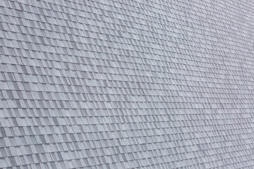 Installation of roof asphalt shingles. Bitumen roof shingles texture.