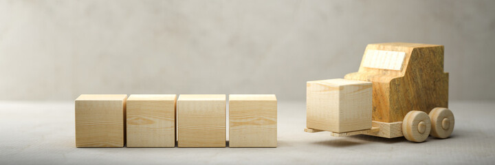 a forklift is moving empty wooden cubes for own messages and icons on concrete background